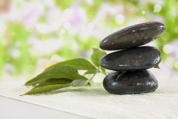 stones with towel and leaf