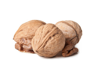 Walnut and a cracked walnut isolated on the white background