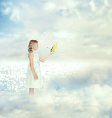 Little girl holding a butterfly