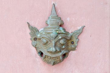 Thai style molding art on pink wall