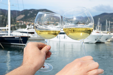 Pair of wineglasses in the hands