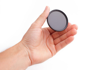 light filter photograph in hand on isolated white background