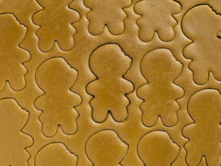 image of gingerbread man shapes on dough