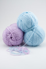 Balls of pink and blue yarn