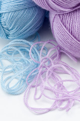 Balls of pink and blue yarn
