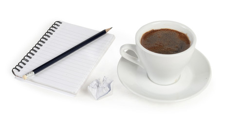 Obraz na płótnie Canvas spiral squared notebook with cup of coffee