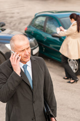 Man on the phone after colliding car