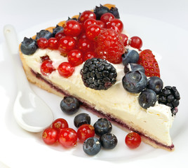 Piece of a pie with fresh berries