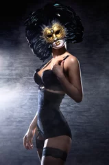 A young woman in erotic lingerie and a Venetian mask © Acronym