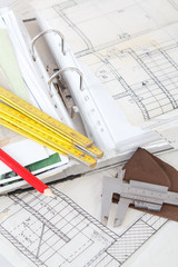 Architectural plans measuring tools and file with the project