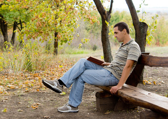 Man relaxing with a book