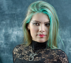 The portrait of goth girl with green hair