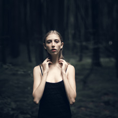 portrait of a beautiful girl in the woods