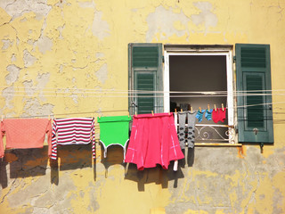 Clothes on the line by a window. Camogli, Italy