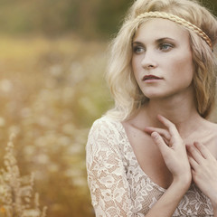 portrait of a beautiful blonde in the field