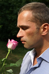 Man smelling a rose