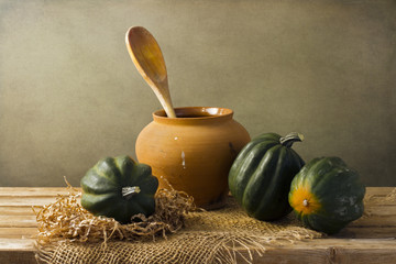 Still life with acorn squash on wooden tabletop © maglara