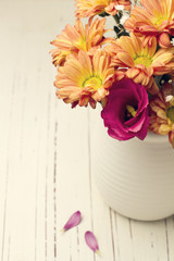 Beautiful flower bouquet on white wooden tabletop