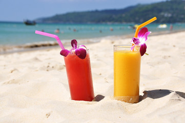 Pair of fruit shakes on the tropical beach