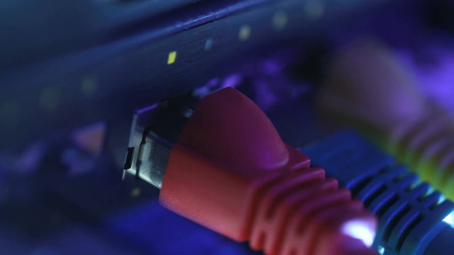 Network Hub and cables with flickering lights