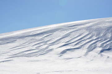 Fototapeta na wymiar Snowdrifts in Swiss Alps