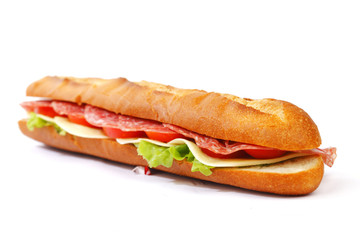 Long sandwich with  salami tomatoes isolated on white