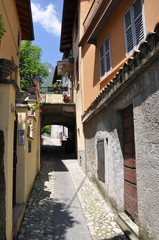 Fototapeta na wymiar Narrow street of Tremezzo town at the famous Italian lake Como