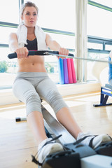 Woman on the rowing machine