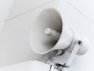 An old loudspeaker on the naval wall