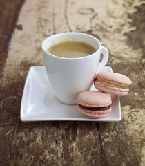 Strawberry & caramel macrons with cup of coffee