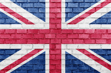 Fototapeta premium United Kingdom (UK) flag on a brick wall