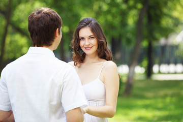 Fototapeta premium Young love Couple smiling under blue sky