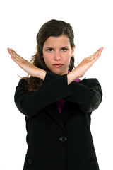 A businesswoman gesturing a stop sign.