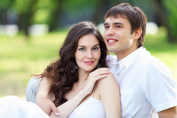 Young love Couple smiling under blue sky