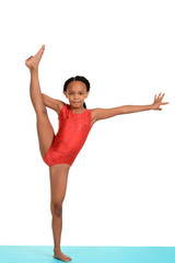 Black child doing gymnastics split