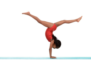 Young black child doing gymnastics front walkover