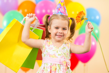 pretty child girl with colorful balloons and gifts on birthday p © Oksana Kuzmina