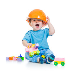 kid playing with building blocks toy
