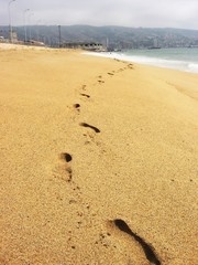 Footmarks on sandy beach of Valparaiso, Chile