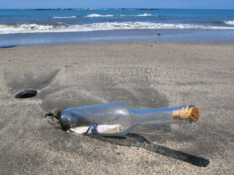 Bottle with a message on the black sand of Tenerife island, Cana