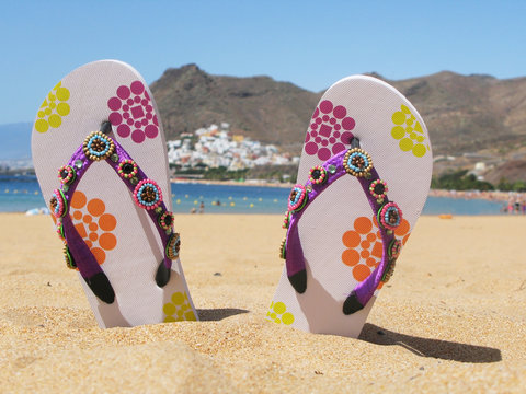 Flip-flops in the sand of Teresitas beach. Tenerife island, Cana