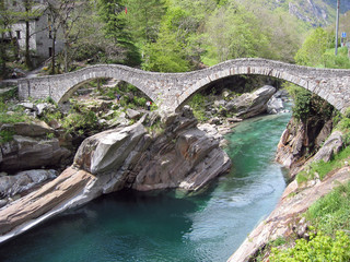 Ancient double arch stone bridge in Verzasca valley, Switzerland