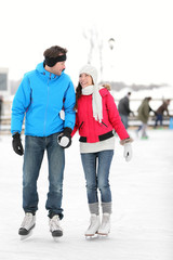 Romantic couple ice skating