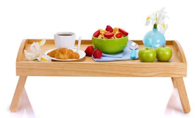 light breakfast on wooden tray isolated on white