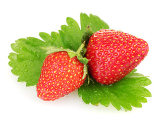 sweet ripe strawberries with leaves isolated on white