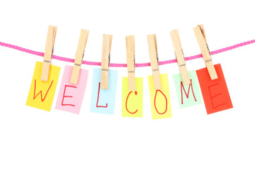 Colorful word hang on rope by wooden peg isolated on white