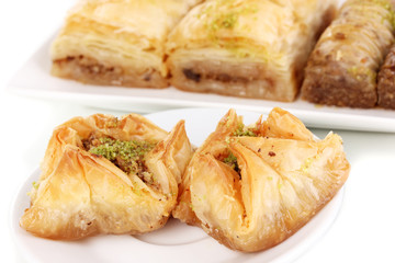 Sweet baklava on plates close-up