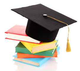 Grad hat with books isolated on white