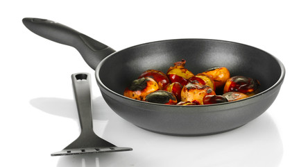 roasted chestnuts in the pan isolated on white