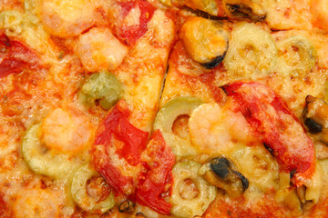 tasty pizza with shrimps and mussels close-up